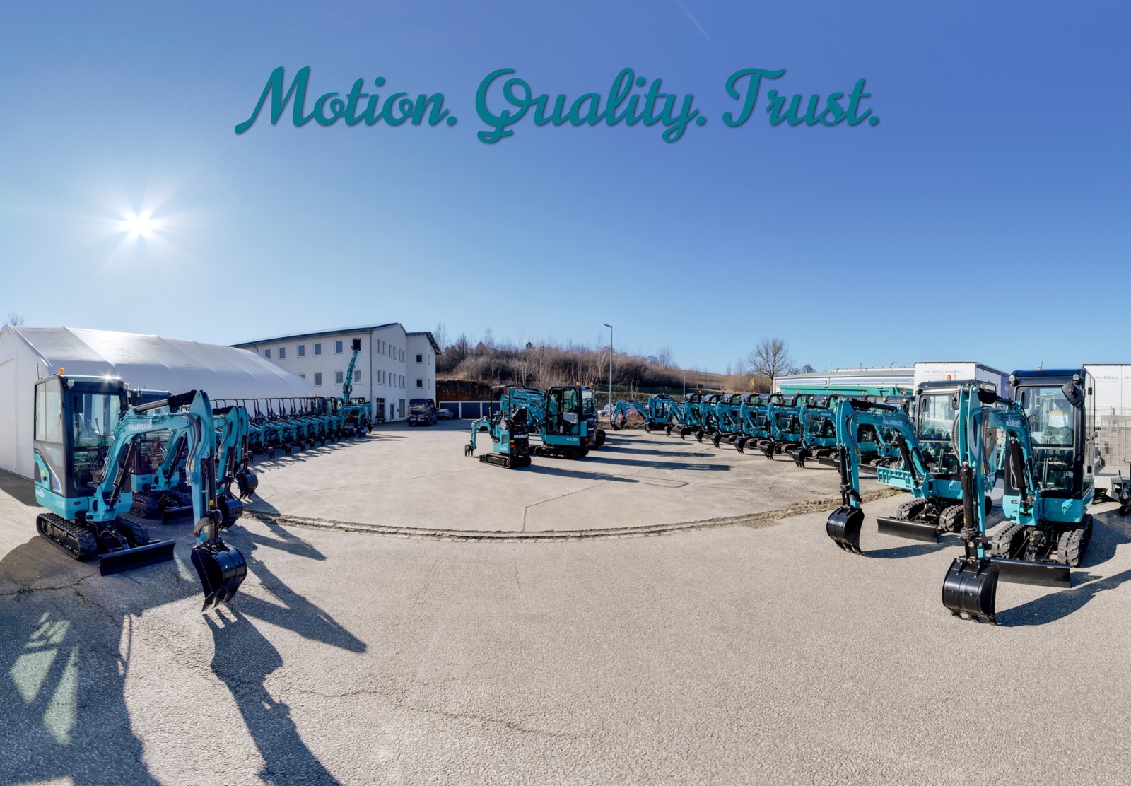 NEUMEIER company premises with mini excavators, lettering Motion. Quality. Trust.